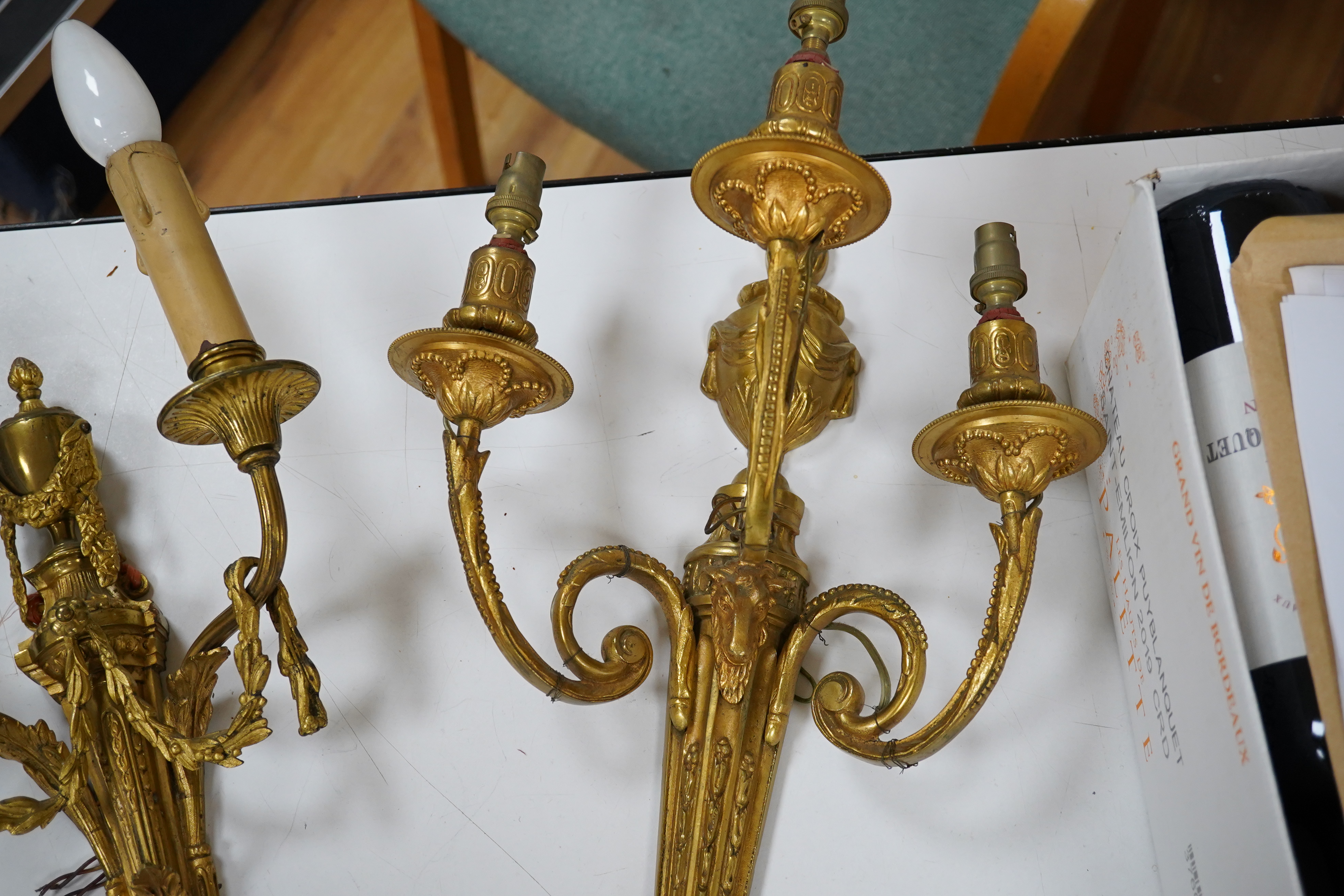 Two early 20th century ormolu wall sconces, largest 44cm. Condition - fair to good